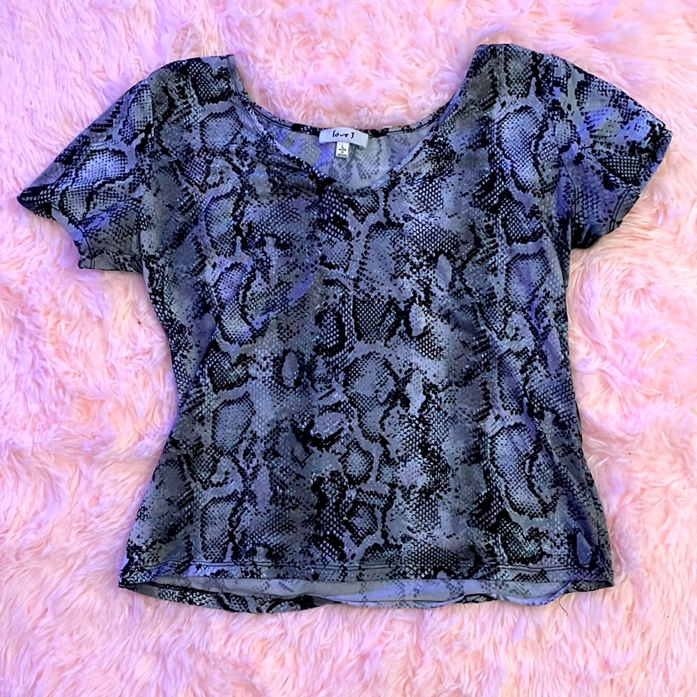 This snake skin shirt is by Love J. This shirt is a size large in women’s.